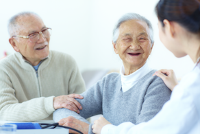 Life Assure Seniors Smiling And Speaking With Caregiver At Home Blog